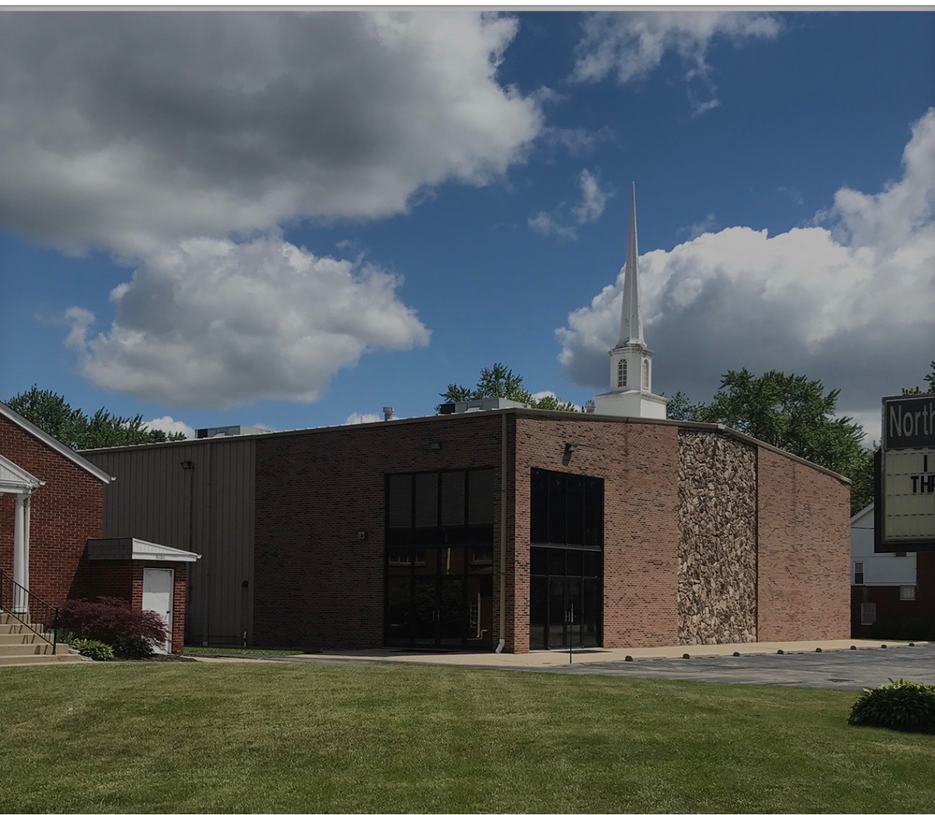 Northwest Baptist Church in Toledo, with its brick exterior and tall white steeple